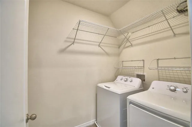 a utility room with dryer and washer
