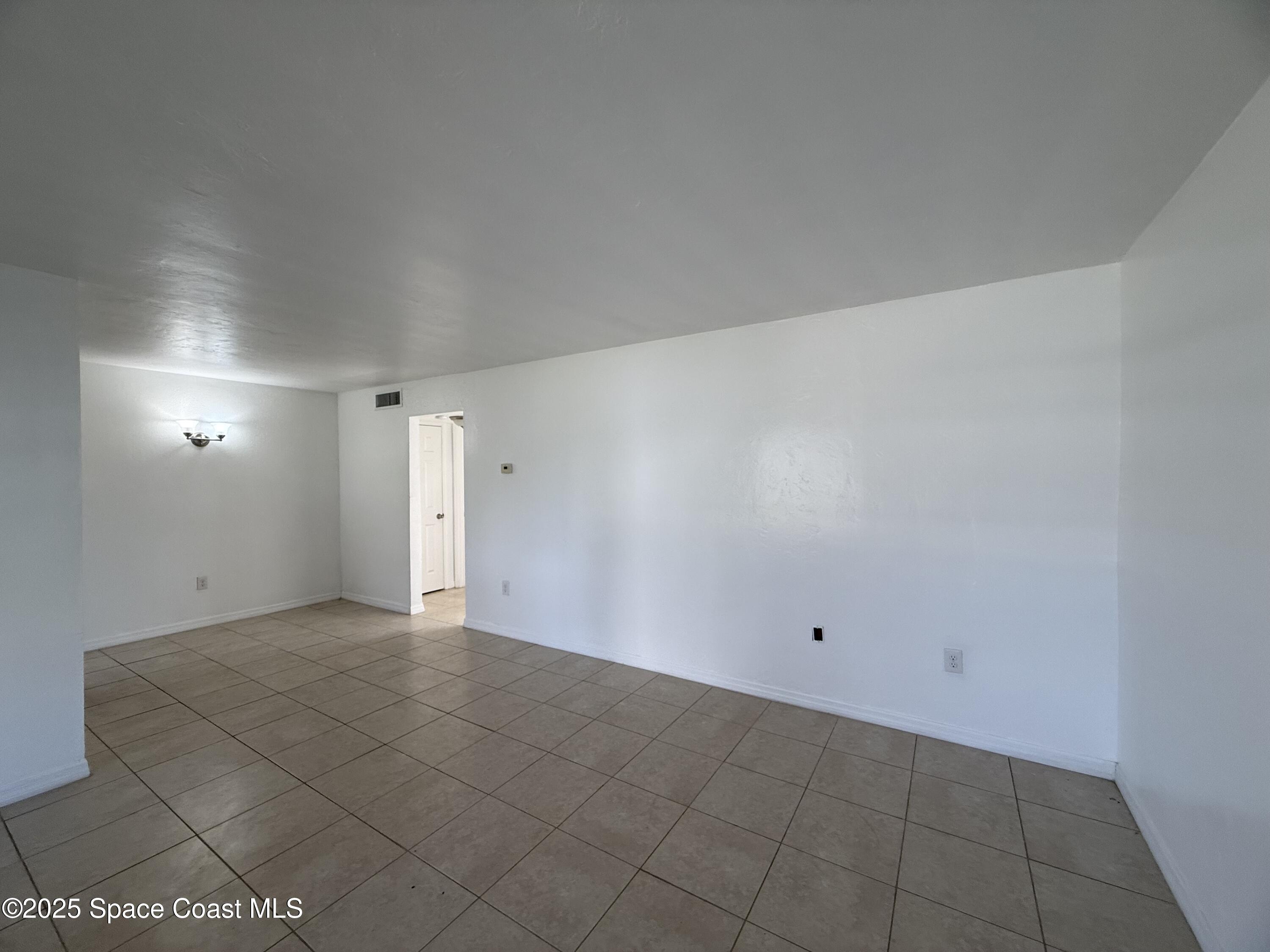 1440 Parkway Drive, Unit 8A Melbourne, FL 32935 - Photo 3 of 21 a view of an empty room