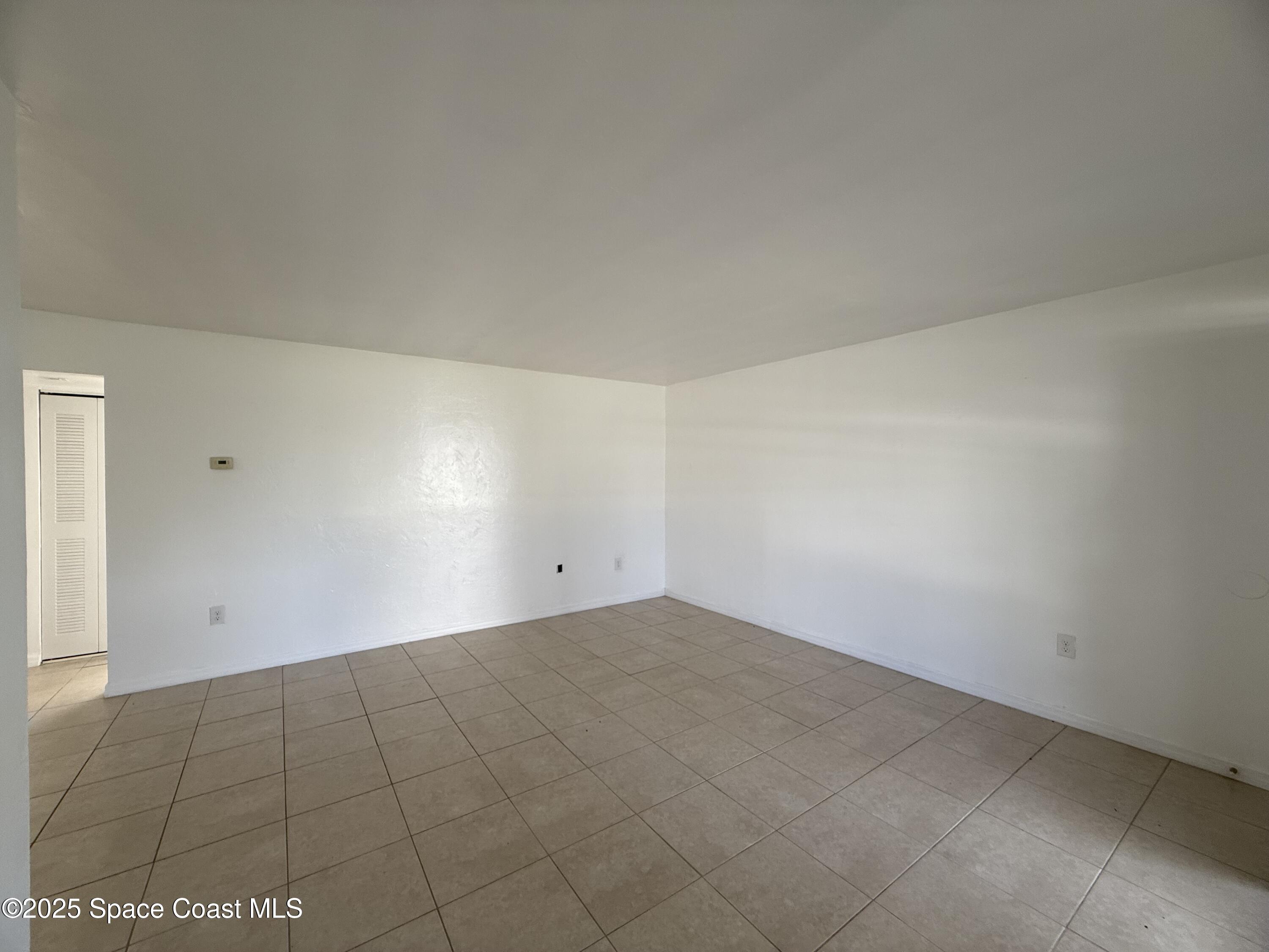 1440 Parkway Drive, Unit 8A Melbourne, FL 32935 - Photo 4 of 21 a view of an empty room