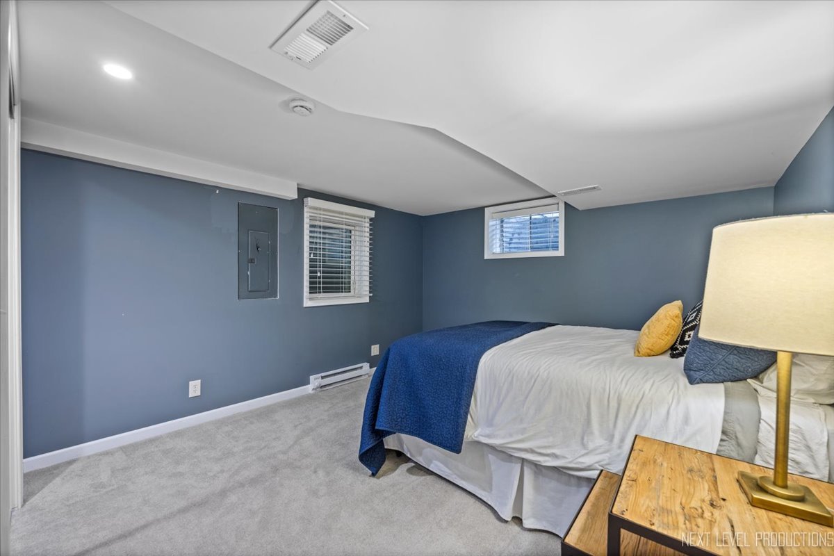 602 Highbury Lane Geneva, IL 60134 - Photo 20 of 28 a bed room with a bed and a couch