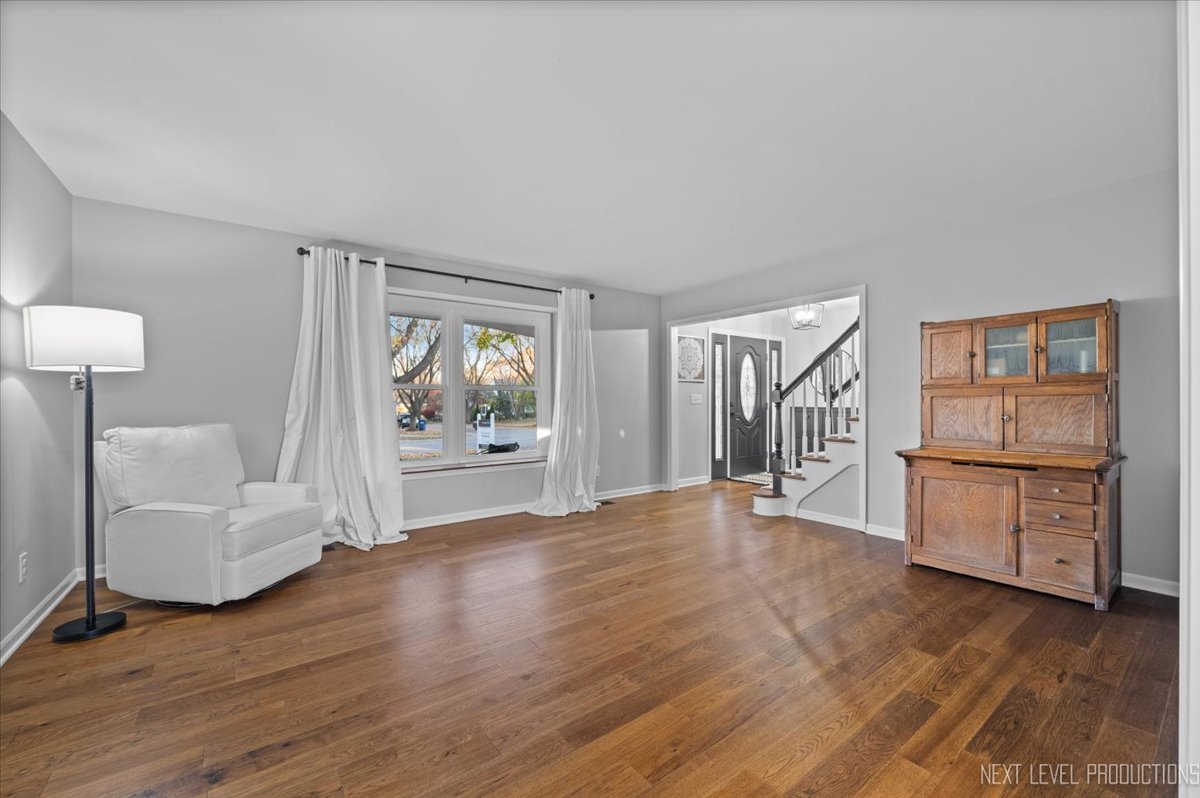 602 Highbury Lane Geneva, IL 60134 - Photo 6 of 28 a view of livingroom with furniture and wooden floor