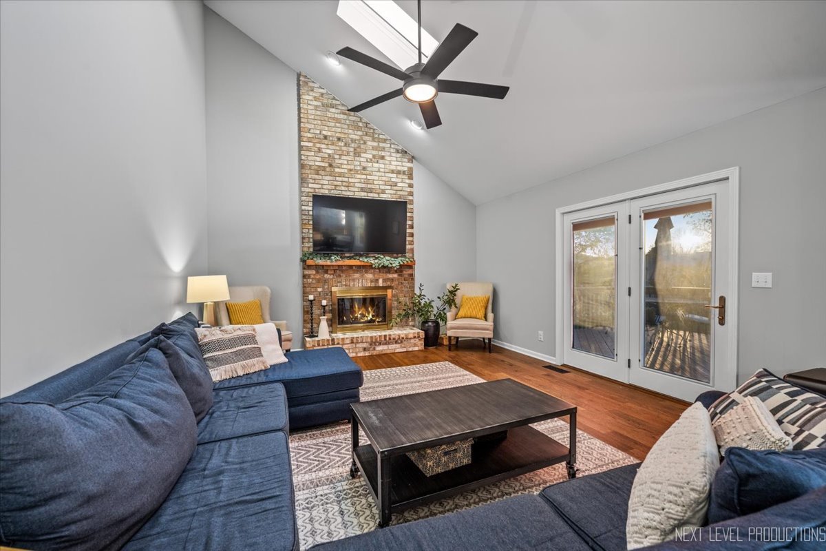 602 Highbury Lane Geneva, IL 60134 - Photo 8 of 28 a living room with furniture a ceiling fan and a rug