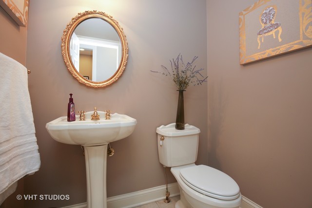 7-n346 7-n346 7n346 Ridge St. Charles, IL 60175 - Photo 19 of 31 a bathroom with a toilet sink and mirror
