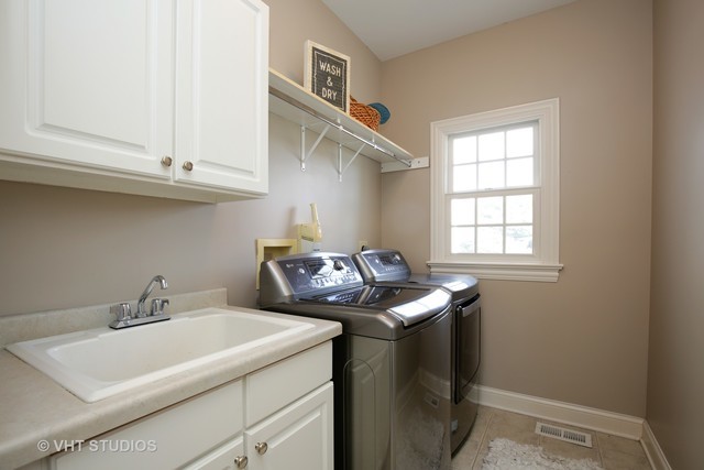 7-n346 7-n346 7n346 Ridge St. Charles, IL 60175 - Photo 24 of 31 a utility room with dryer and washer