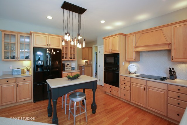 7-n346 7-n346 7n346 Ridge St. Charles, IL 60175 - Photo 6 of 31 a kitchen with cabinets a counter space dining table and stainless steel appliances