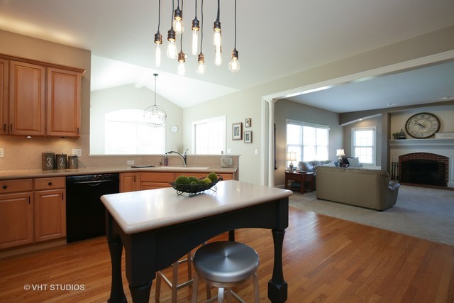 7-n346 7-n346 7n346 Ridge St. Charles, IL 60175 - Photo 7 of 31 a kitchen with a table and chairs in it
