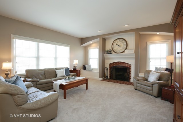 7-n346 7-n346 7n346 Ridge St. Charles, IL 60175 - Photo 9 of 31 a living room with furniture a large window and a fireplace