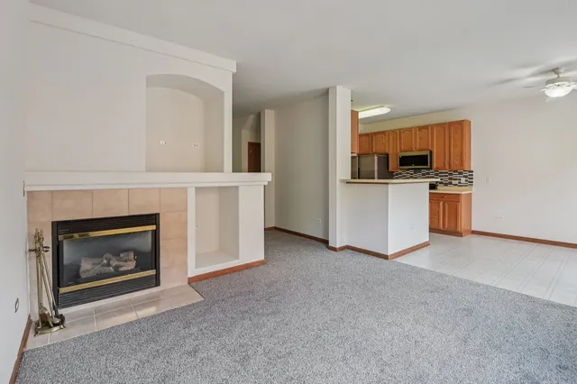a view of a livingroom with a fireplace and a fireplace
