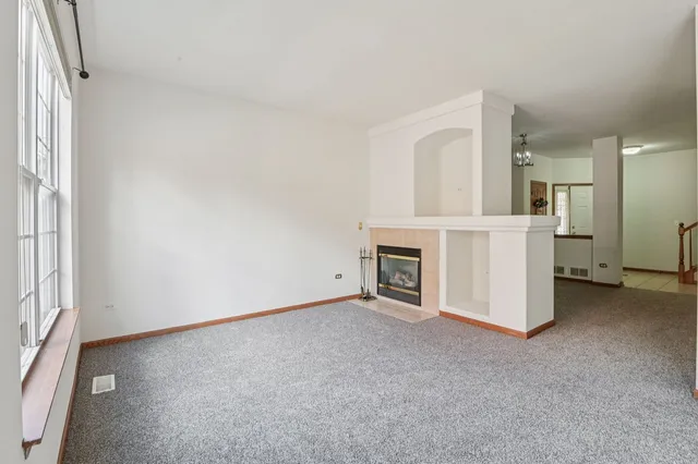 an empty room with a fireplace