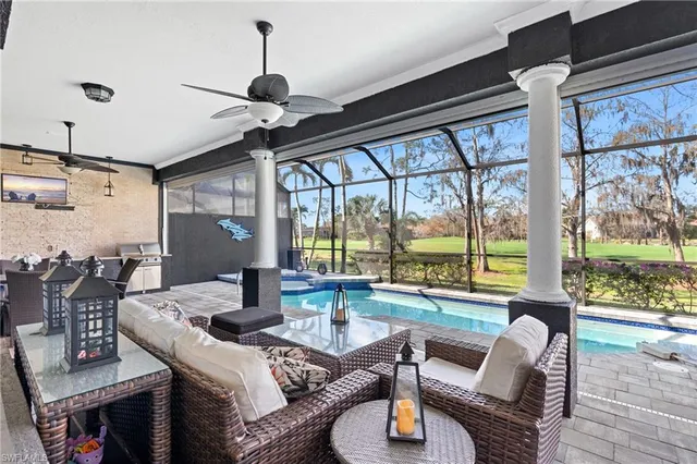a dining room with furniture a chandelier and wooden floor