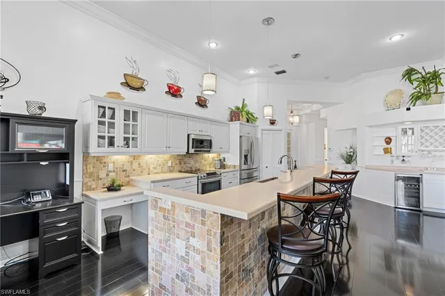 a view of kitchen with cabinets and wooden floor