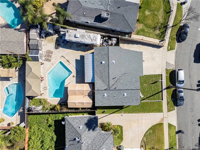 an aerial view of multiple houses with outdoor space