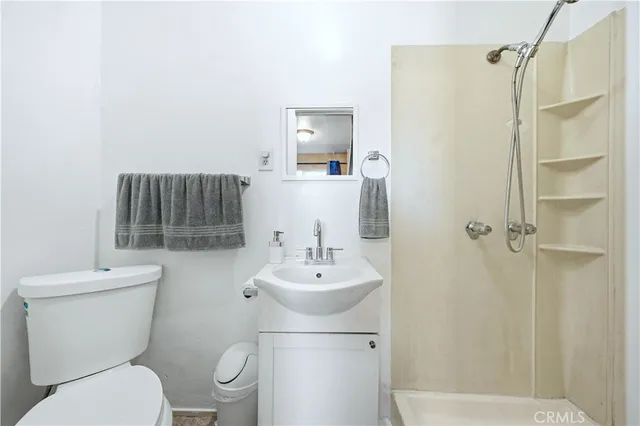 an aerial view of a swimming pool with outdoor seating