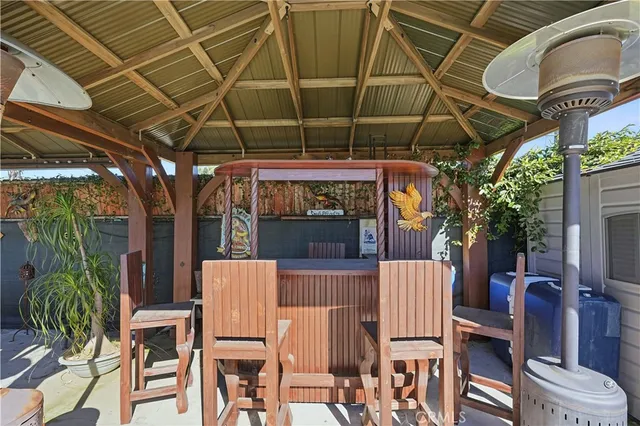 a view of a chairs and table in the patio