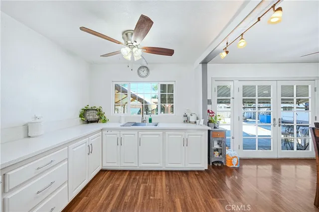 a kitchen with cabinets a sink and appliances