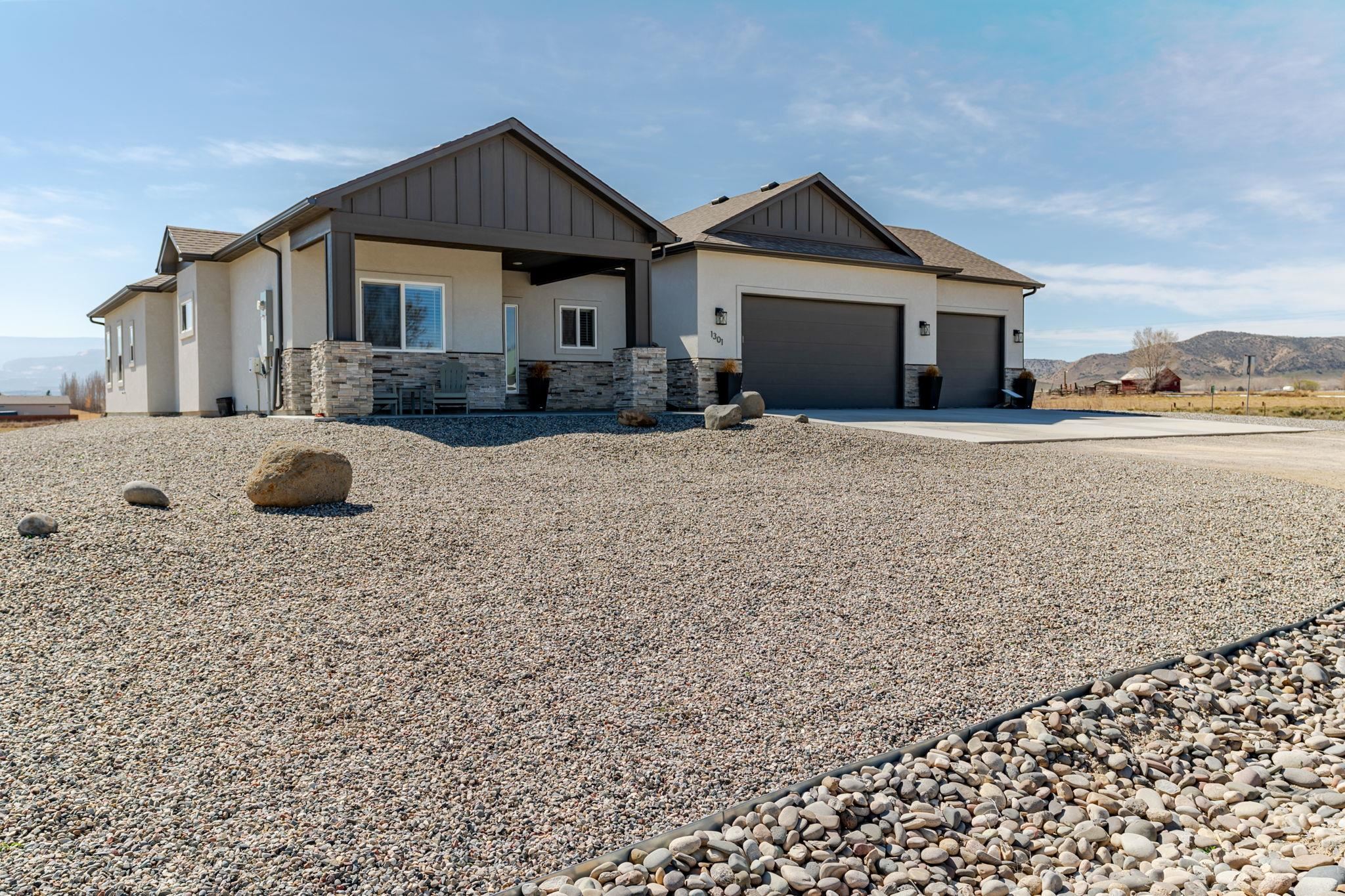 1301 M Road Loma, CO 81524 - Photo 7 of 32 a front view of a house with a yard