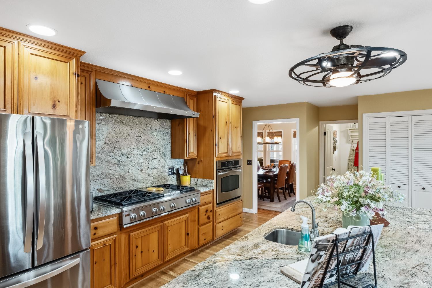 5701 Ridgewood Road Willits, CA 95490 - Photo 16 of 84 a kitchen with stainless steel appliances granite countertop a refrigerator and a stove