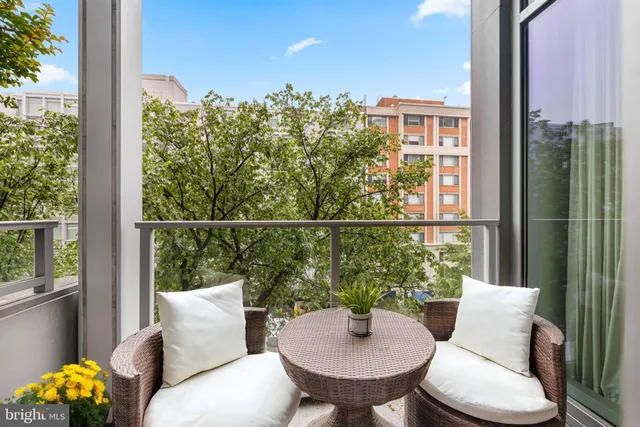 a view of a chair and table in the balcony