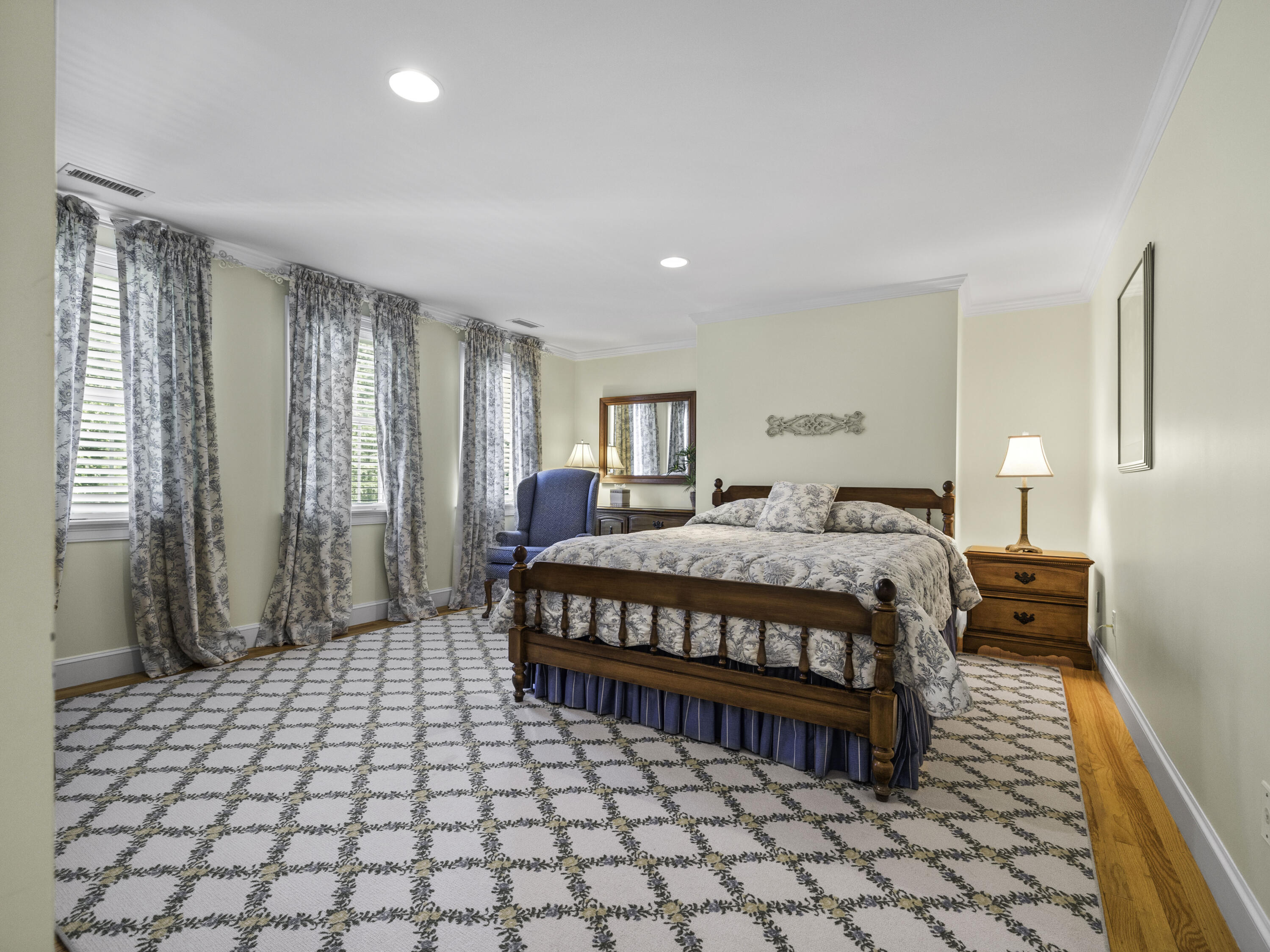 405 Baxter Neck Road Marstons Mills, MA 02648 - Photo 13 of 36 a spacious bedroom with a bed and a lamp