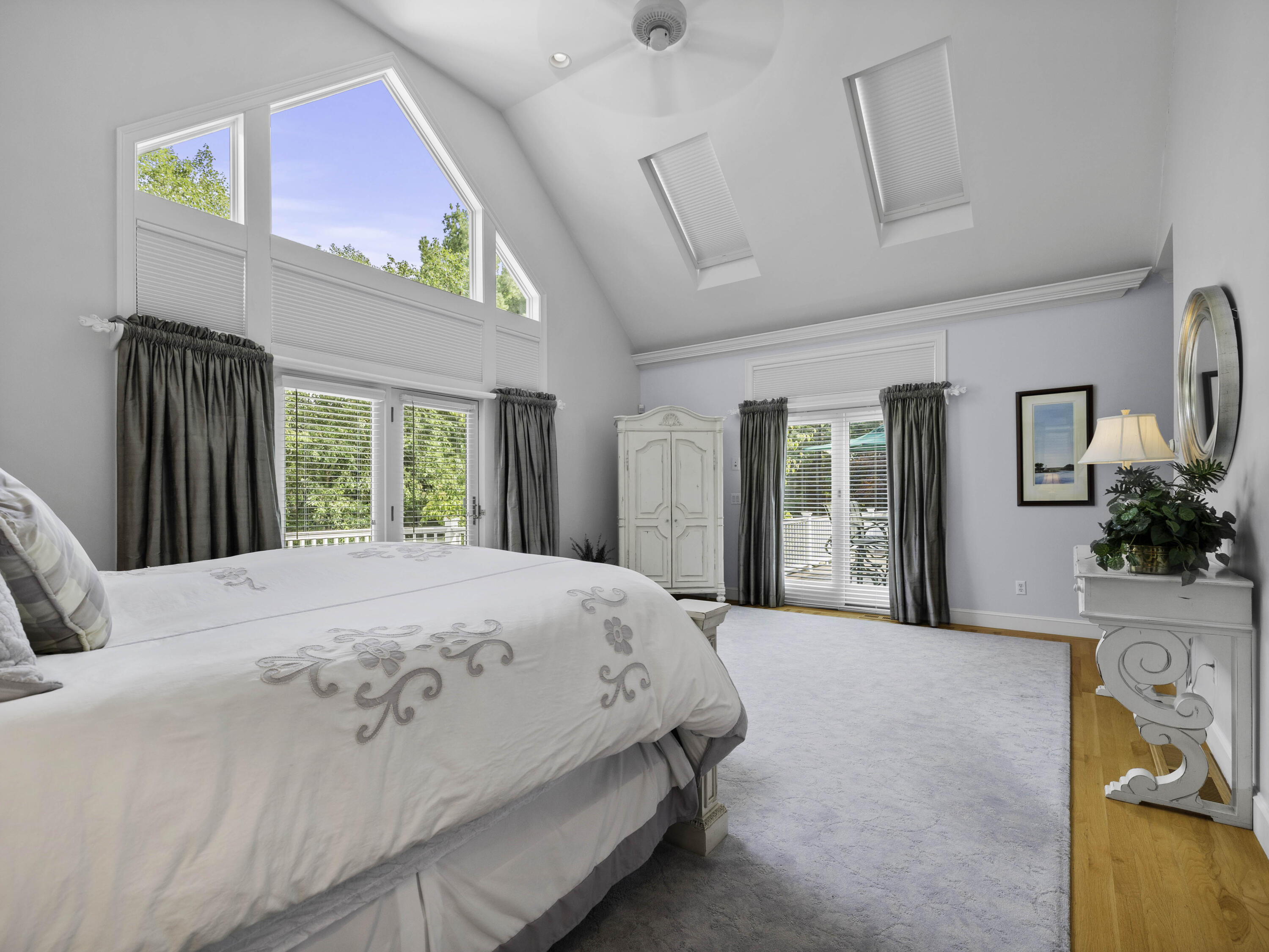 405 Baxter Neck Road Marstons Mills, MA 02648 - Photo 14 of 36 a bedroom with a large bed and a large window