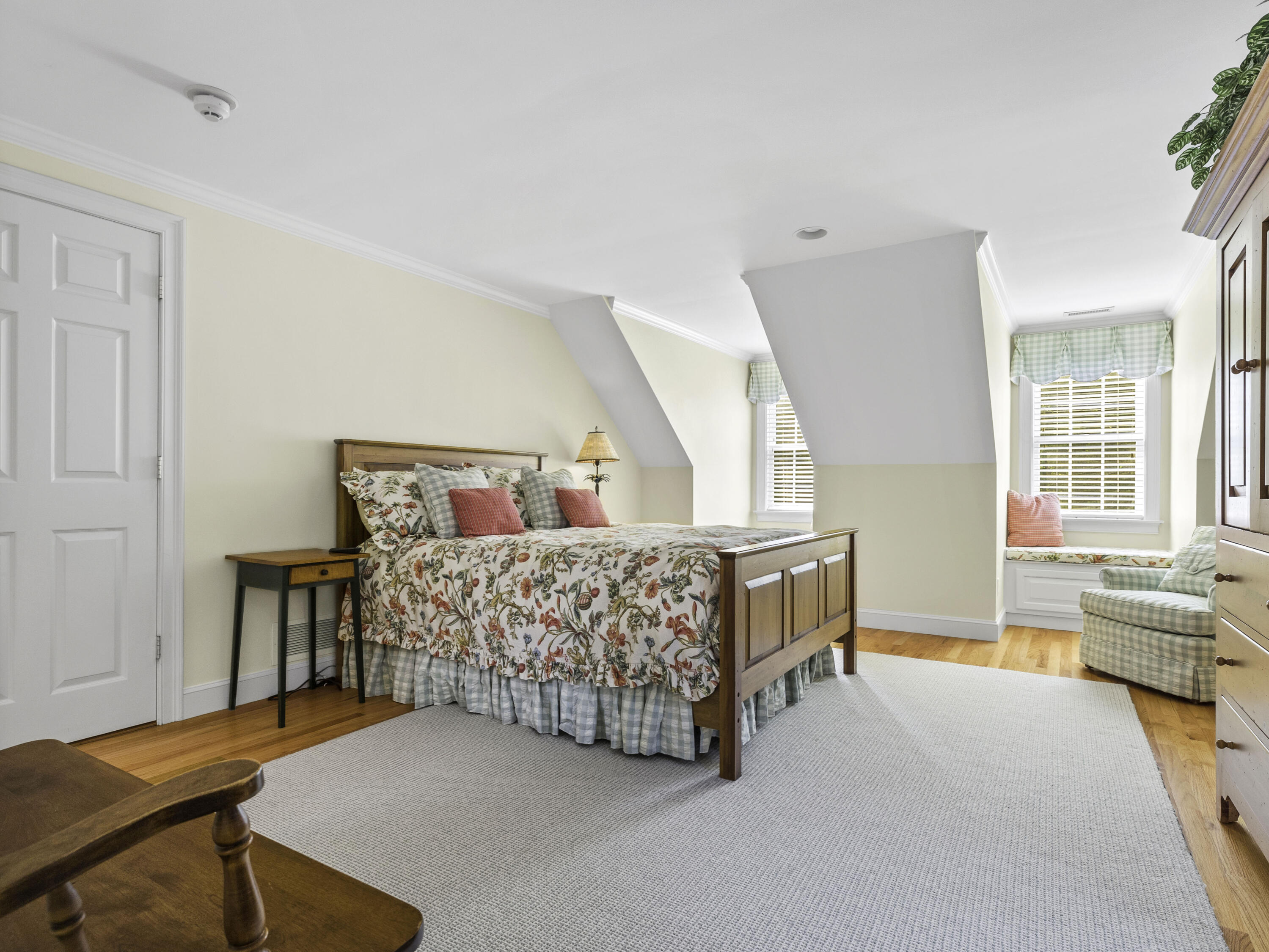 405 Baxter Neck Road Marstons Mills, MA 02648 - Photo 17 of 36 a bedroom with a bed and a wooden floor