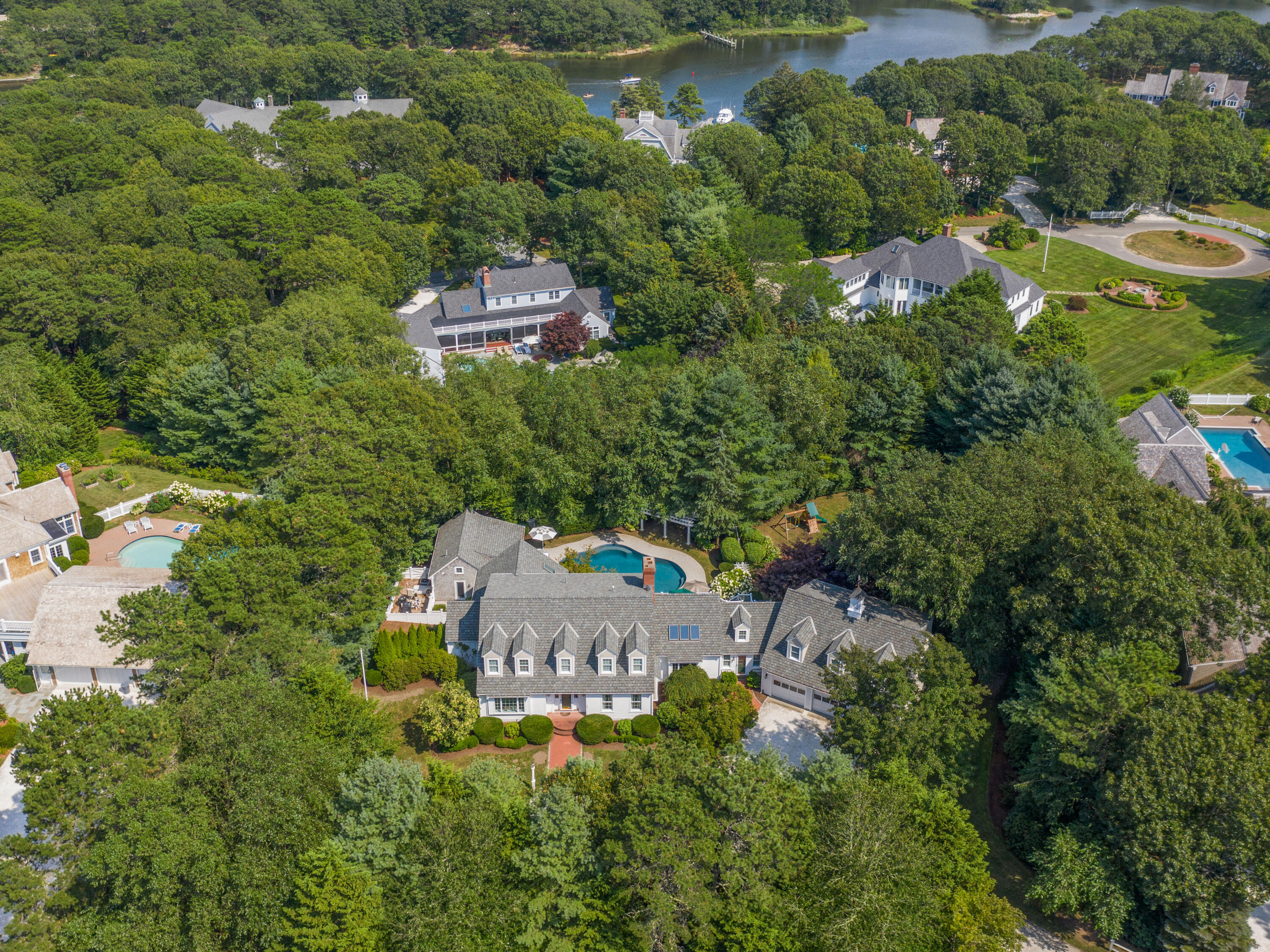 405 Baxter Neck Road Marstons Mills, MA 02648 - Photo 2 of 36 an aerial view of house with yard and outdoor seating