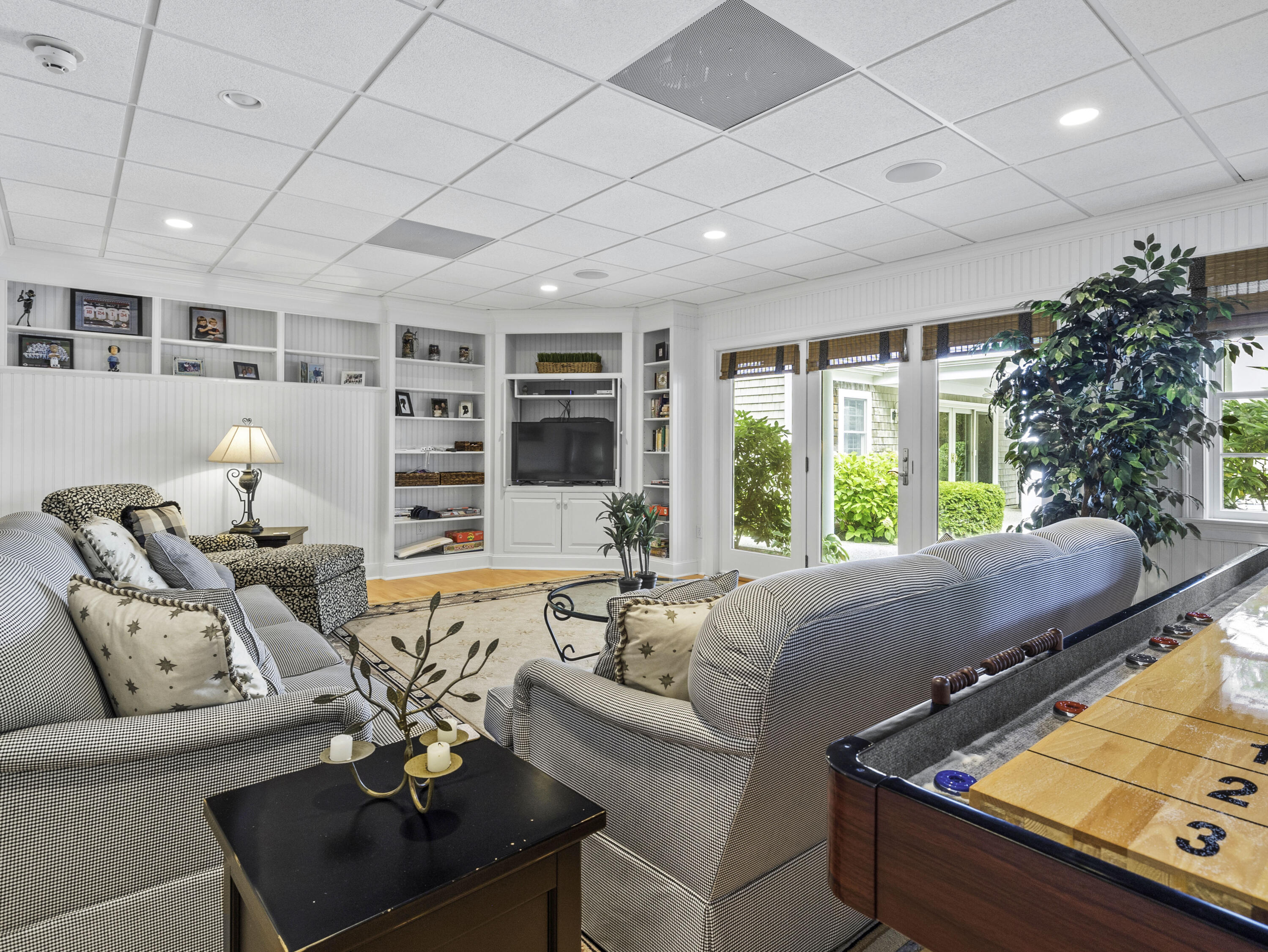 405 Baxter Neck Road Marstons Mills, MA 02648 - Photo 23 of 36 a living room with furniture and a large window