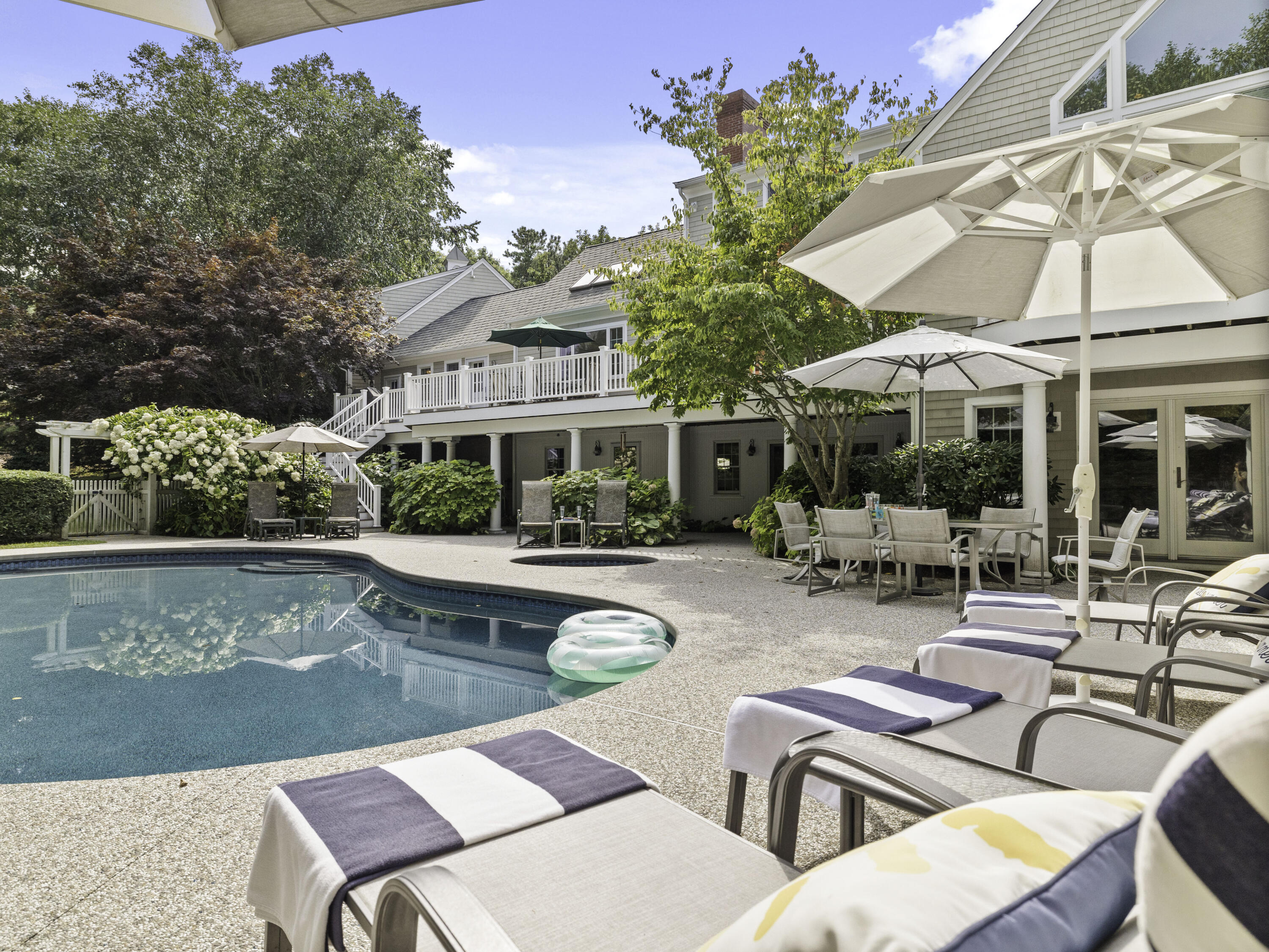405 Baxter Neck Road Marstons Mills, MA 02648 - Photo 28 of 36 a view of a patio with swimming pool table and chairs