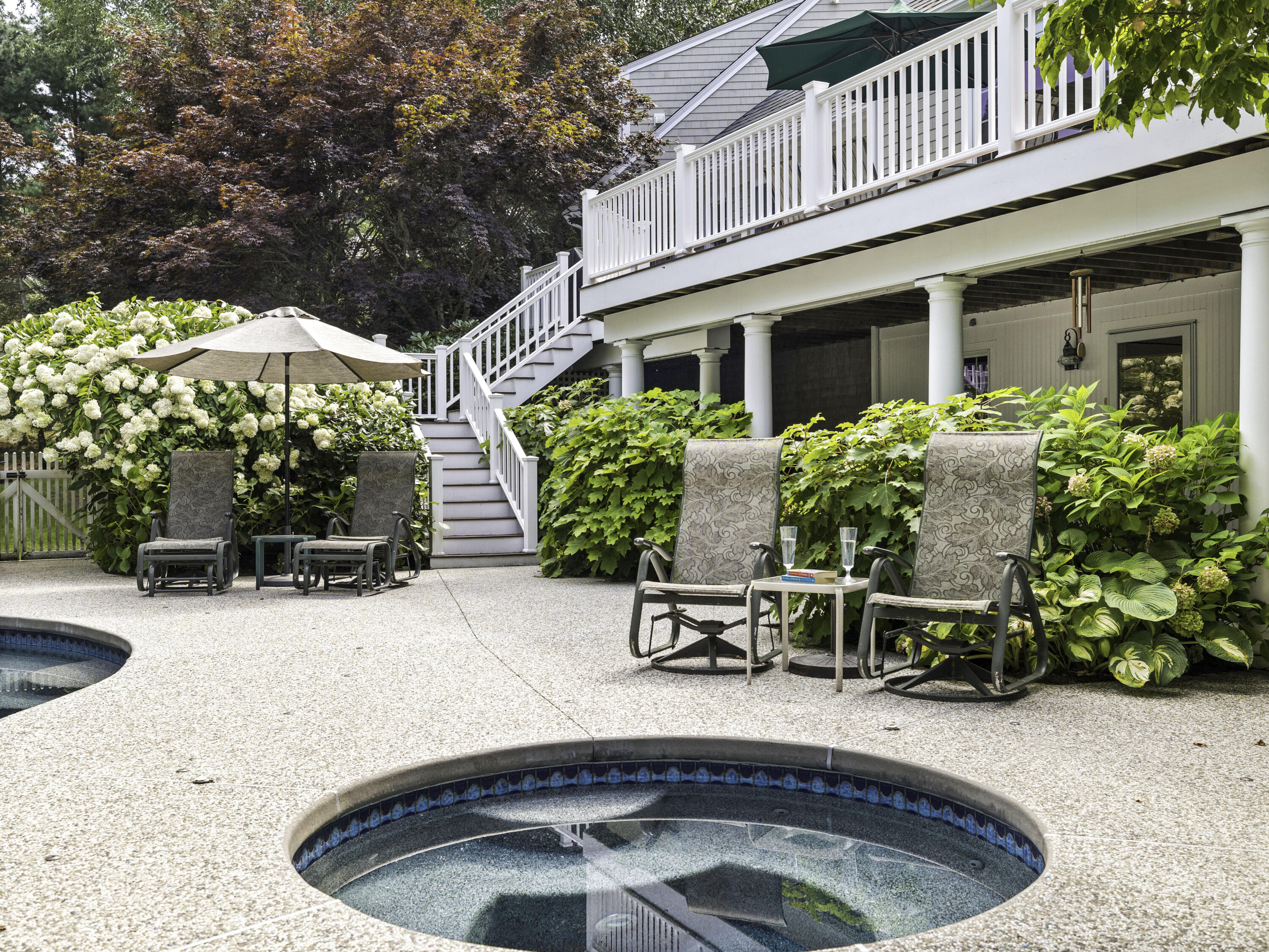 405 Baxter Neck Road Marstons Mills, MA 02648 - Photo 29 of 36 a view of a house with backyard porch and sitting area