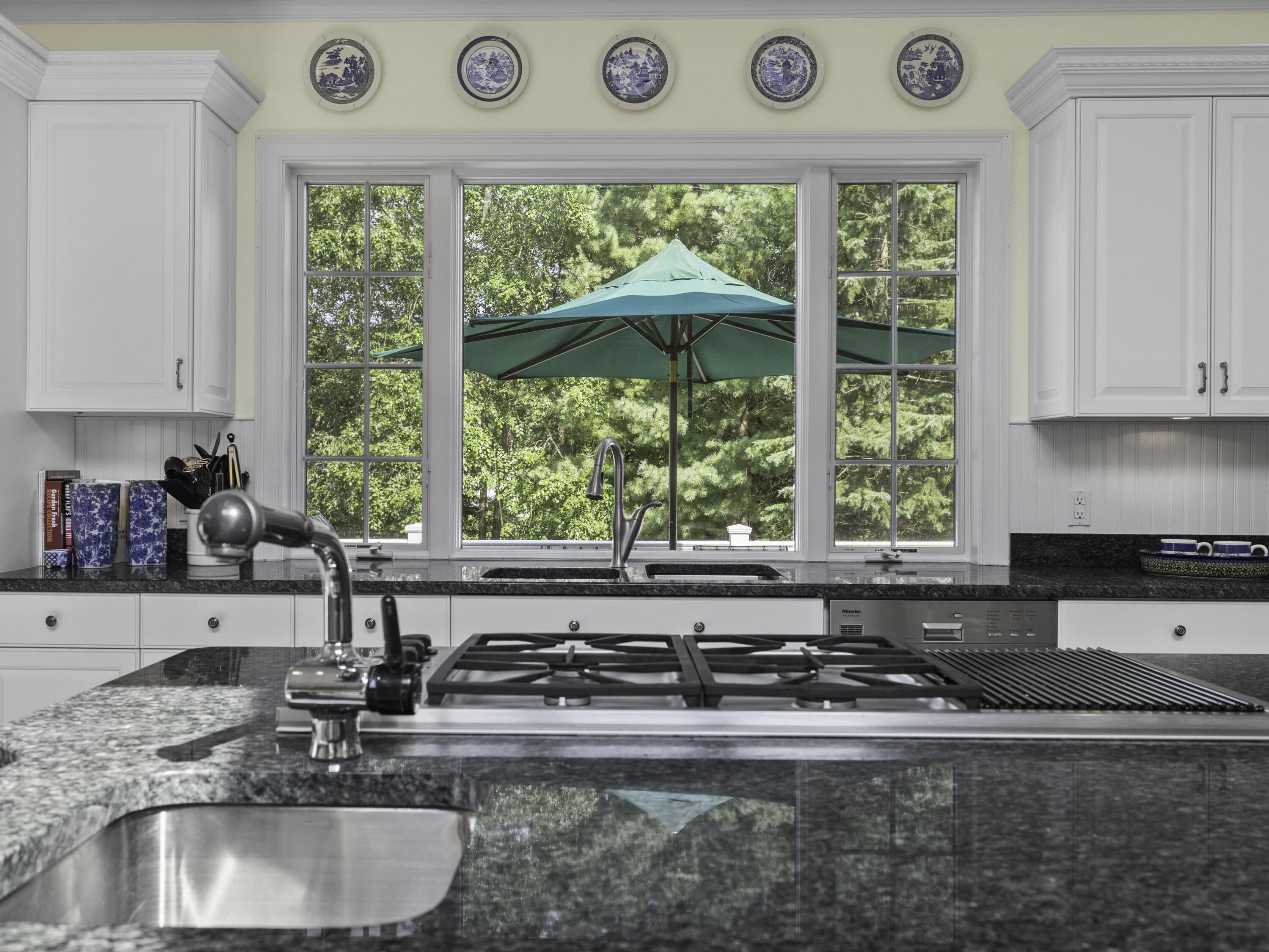 405 Baxter Neck Road Marstons Mills, MA 02648 - Photo 10 of 36 a kitchen with a stove a sink and a granite counter tops