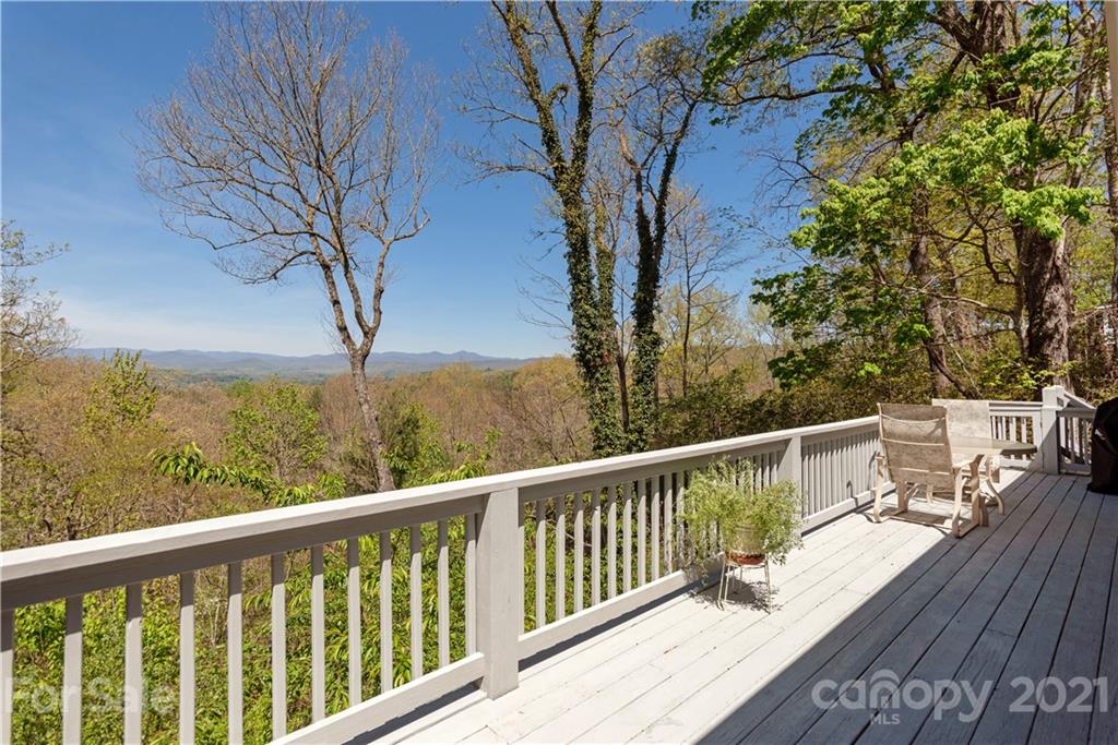 5561 Spring Road Hendersonville, NC 28739 - Photo 2 of 30 a view of a balcony with wooden floor and fence