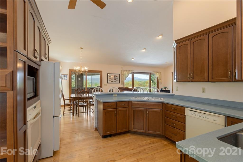 5561 Spring Road Hendersonville, NC 28739 - Photo 14 of 30 a kitchen with lots of counter top space and stainless steel appliances
