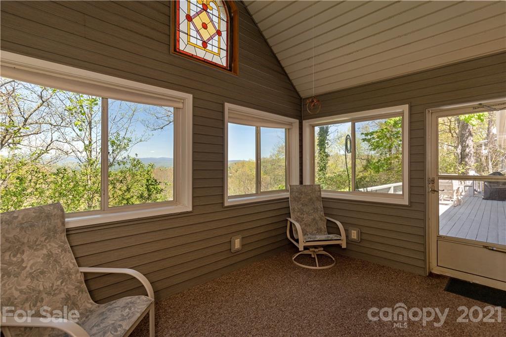 5561 Spring Road Hendersonville, NC 28739 - Photo 15 of 30 a room with gym equipment and large windows
