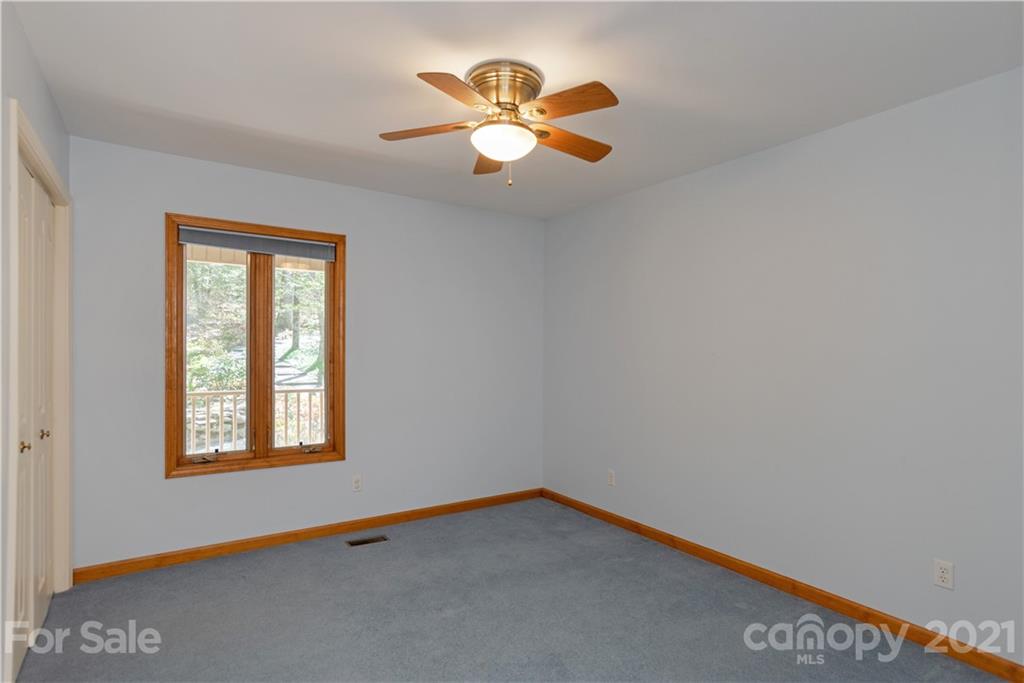 5561 Spring Road Hendersonville, NC 28739 - Photo 21 of 30 a view of an empty room with a window