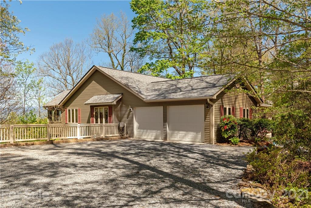 5561 Spring Road Hendersonville, NC 28739 - Photo 26 of 30 a front view of a house with a garden