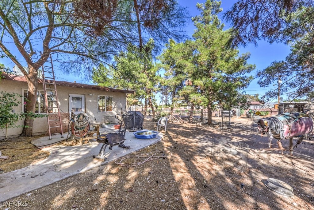 4216 North Decatur Boulevard North Las Vegas, NV 89032 - Photo 17 of 36 View of yard with a patio and a fire pit