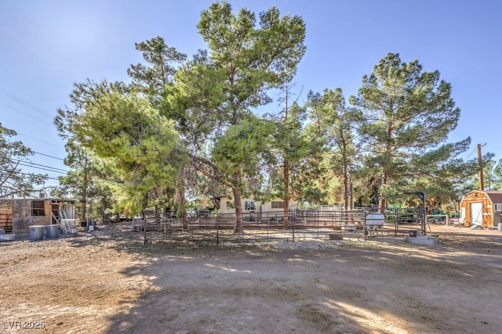 4216 North Decatur Boulevard North Las Vegas, NV 89032 - Photo 22 of 36 View of yard featuring an outdoor structure