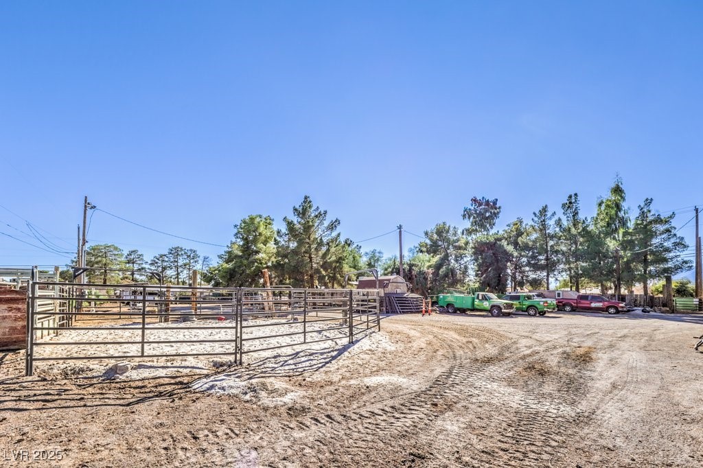 4216 North Decatur Boulevard North Las Vegas, NV 89032 - Photo 25 of 36 View of yard featuring an outbuilding and an exterior structure