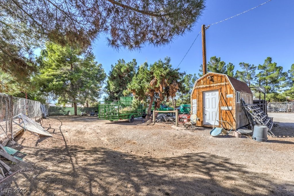 4216 North Decatur Boulevard North Las Vegas, NV 89032 - Photo 27 of 36 View of jungle gym featuring a storage shed