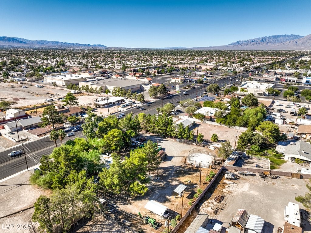 4216 North Decatur Boulevard North Las Vegas, NV 89032 - Photo 35 of 36 Aerial perspective of suburban area featuring a mountain backdrop