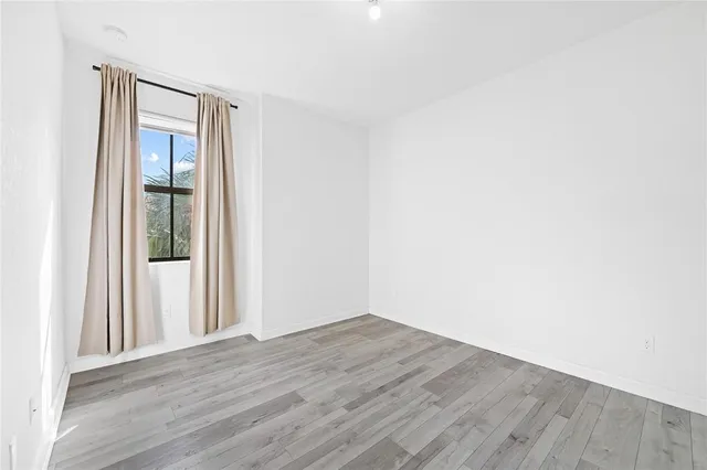 a view of a workspace with furniture and a bookshelf
