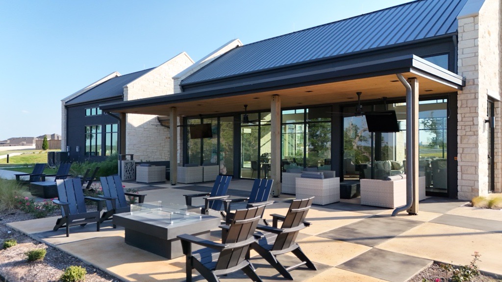 248 Prickly Poppy Way Georgetown, TX 78633 - Photo 4 of 26 An inviting outdoor gathering space with a fire pit offers relaxation and community.
