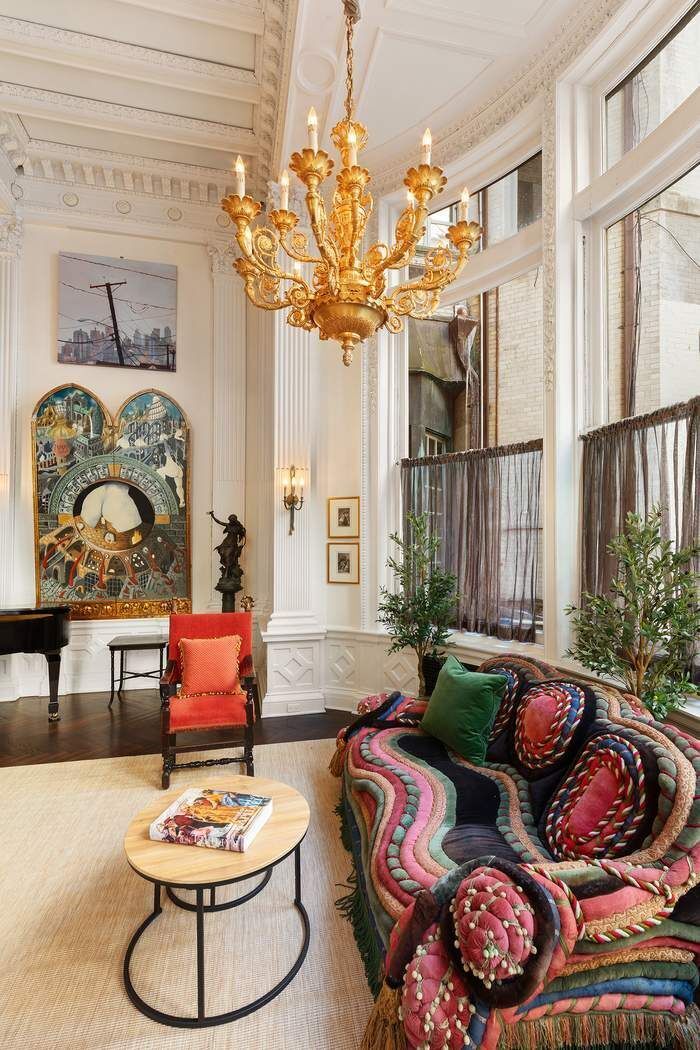 11 East 73rd Street, Unit 1D Manhattan, NY 10021 - Photo 7 of 18 a living room with furniture and a chandelier