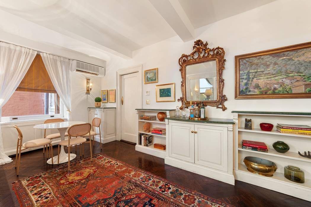 11 East 73rd Street, Unit 1D Manhattan, NY 10021 - Photo 8 of 18 a living room with furniture and a window