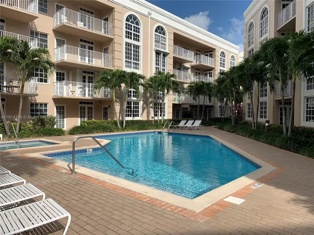 a view of a building with a swimming pool