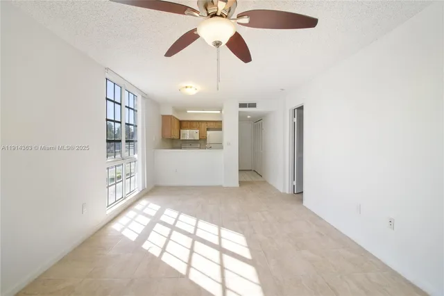 a view of an empty room with a window