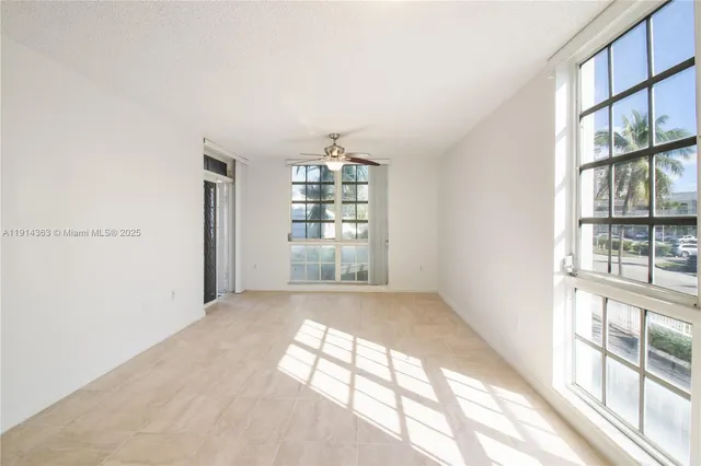 a view of empty room with windows