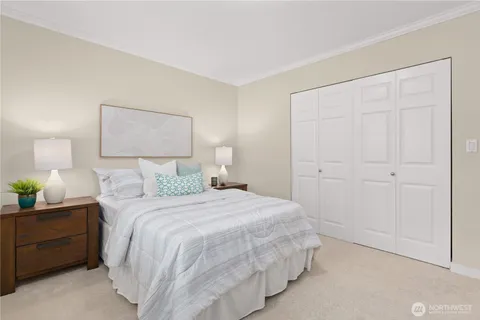 a bedroom with a bed and a lamp