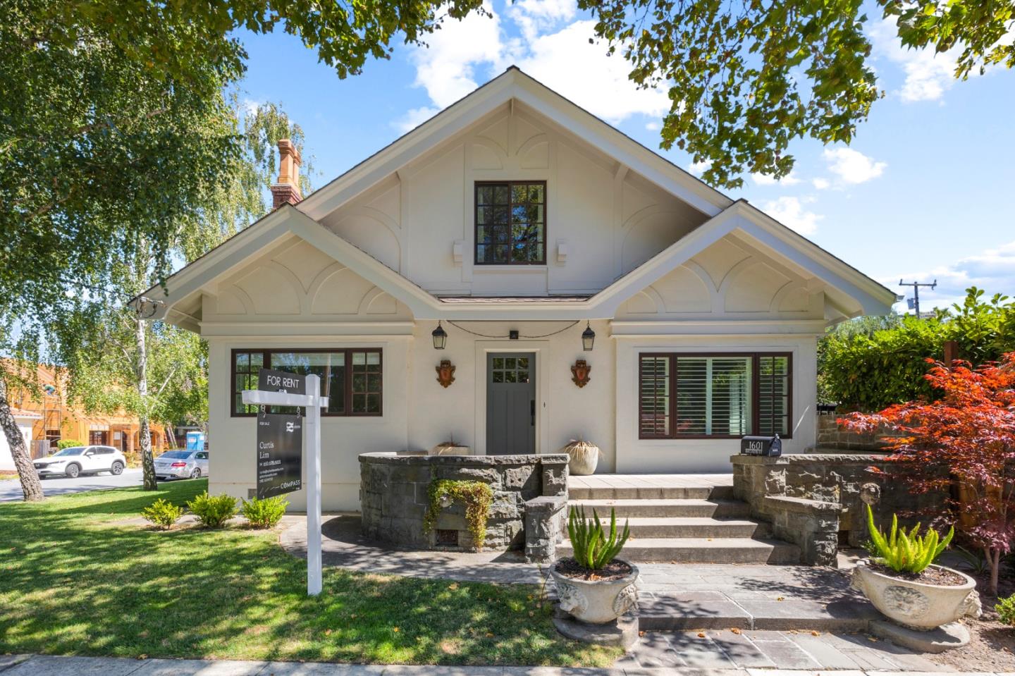 a front view of a house with garden