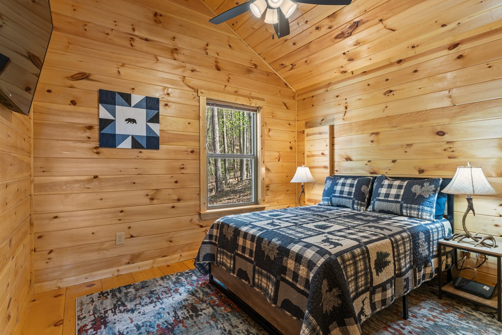 237 Bentley Cove Murphy, NC 28906 - Photo 21 of 43 a bedroom with a bed and wooden floor